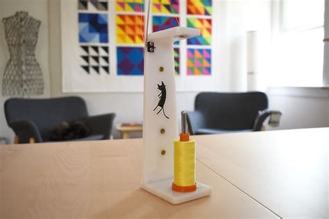 Afbeeldingsresultaten voor How to Use a Cone Thread Spool On Your Home Sewing Machine