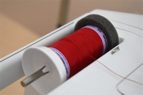 Afbeeldingsresultaten voor How to Use a Cone Thread Spool On Your Home Sewing Machine
