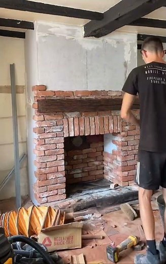 Chimney breast construction in Sunningdale with wood stove installation and reclaimed brick slips