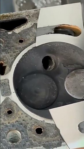 This is the process of cleaning rust on an engine block using a special machine.