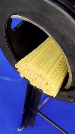 Pasta Making Machine Extruding Fresh Spaghetti