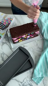 No matter the occasion, this 4-layer cake is the perfect treat! Made using the Easy Layers Loaf Cake Pan Set and tips, 2D, 21, 1M, 4B, and 104, making this cake is just as easy to decorate as it is to assemble. Find the full details on our blog: http://ow.ly/9U9N50FPUie | Wilton Cake Decorating