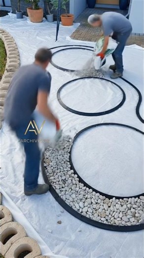 Absolutely stunning curved garden transformation with white stones & red mulch 🤯✨ #DIY #landscaping