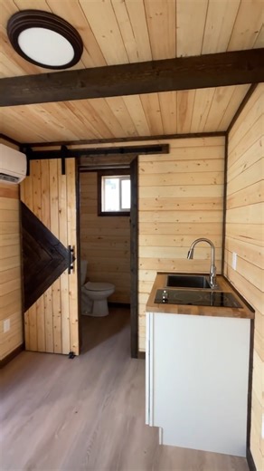 One cozy cabin in a 20ft container! 🏞️ The natural shiplap on the walls and ceiling brings a rustic, outdoorsy feel, making this container home look like it belongs in the mountains—no matter where it’s placed. 🌲 Perfect for creating a livable space in undeveloped areas, whether you want an off-grid cabin in the woods or a retreat on land under development. These homes can be fully off-grid or easily hooked up to RV connections. Where would you put yours? 🚪✨ #ContainerCabin #TinyHomeLiving #O