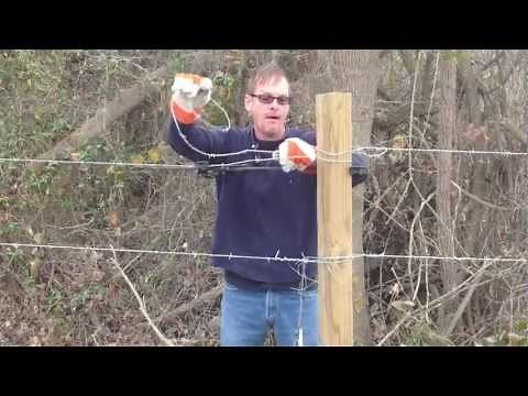 How To Use a barbed wire stretcher while building a fence