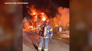 Fire at Addison truck facility spreads to at least 17 vehicles; diesel spill closes road