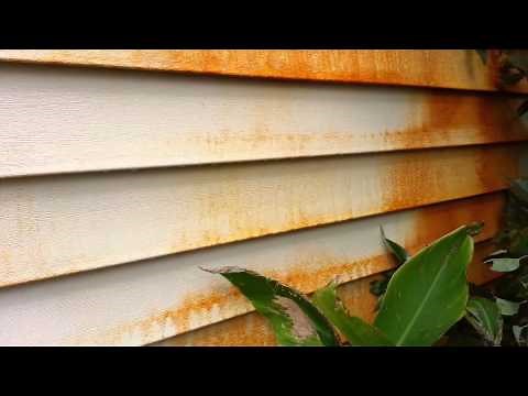 Rust stain removal on vinyl siding.