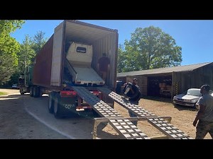 Container unloading with Mayberry mini trucks