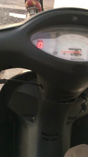 Motorcycle Dashboard Close-Up: Speedometer and Engine