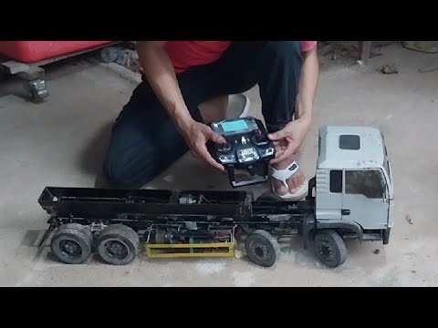 Install a remote-controlled dump truck with a bulldozer and demonstrate its working efficiency