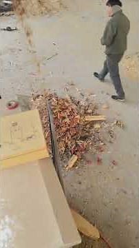 Wood waste shredder machine working on site