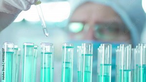 lab assistant works with test tubes in the laboratory