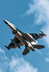 high-speed fighter jet performing a smooth fly-by above the clouds #cleanflight