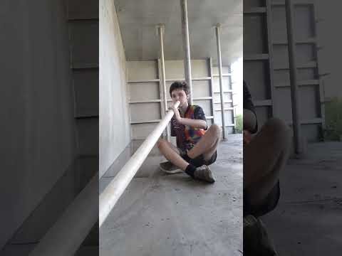 Self-Made PVC Pipe Low Slide Didgeridoo Solo, In A Industrial Rectangular Galvanised Water Tank