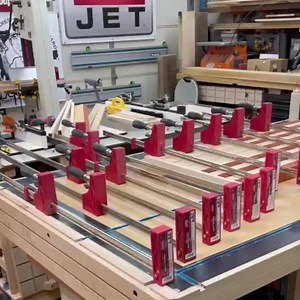 1.7K views · 33 reactions | "An Army of JET Woodworking parallel clamps ready to do what they do. Clamping up a 50” Hard maple and Padauk Flag before hand carving it into an American Masterpiece." Love to see it  You can never have too many clamps, right? VC: The Handy Fireman | JET Tools | Facebook