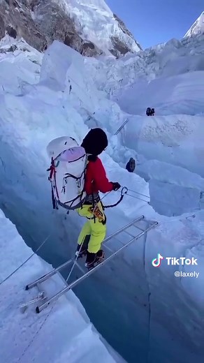 Crossing the Khumbu Icefall on Mount Everest with Ladders
