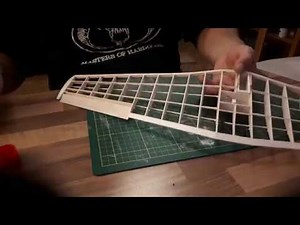 Covering a balsa model airplane with tissue Dutch