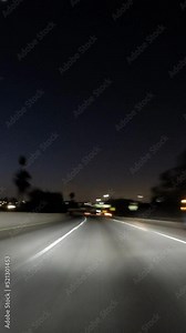 Night driving vertical time lapse video on the Hollywood Harbor and Santa Monica freeways in downtown Los Angeles.