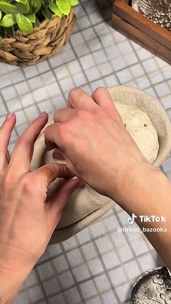 Shaping Sourdough 🔥 Gently shape the dough into a bâtard, tighten with the stitching method, and swaddle it like a baby in the basket once more before placing it in the fridge for overnight fermentation. #artisanbread #bread #foodies #breadrecipe #foodshorts #foodphotography #wildyeast #breadbazooka #sourdough #recipe #bakerylife #baker