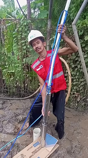 Manual Labor in Construction: Connecting Hose and Pipe
