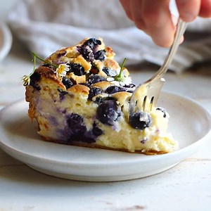 The prettiest simple Blueberry Basque Cheesecake. Just what your Tuesday needs. Inspired by the Basque region of France, this cheesecake has a flaky puff pastry crust surrounding the creamy cheesecake filling. Its deep brown top has cracks all around for an old-world look. Sprinkle fresh summer blueberries over top to complete. It’s really not like any other cheesecake you’ve had before. It’s flaky on the outside, but creamy, rich, and bursting with sweet blueberries inside. Bonus? This is the e