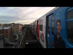 R143 L Train with YouTube SciShow ad wrap arriving at New Lots Avenue