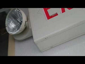 Exit sign with emergency light battery backup