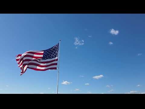 American Flag Blowing in the Wind 4K Stock Drone Video
