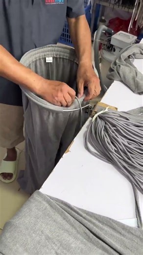 Threading a drawstring through a waistband.#clothing #sewing #craftprocess #fyp #shorts