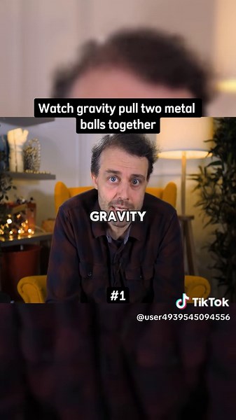 Explore Gravity's Pull on Two Metal Balls