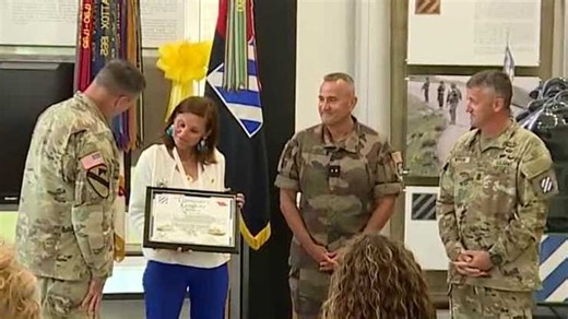 'Nous resterons-la, We shall stay here'; The motto of the Marne Division living on with a French General