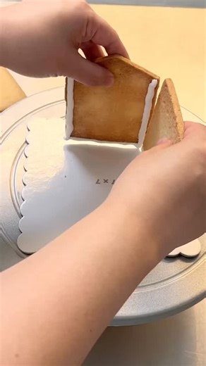 Santa’s Toy Factory: the most classic of our Cookie Houses. Here’s how to build it. Order the entire #RainbowChristmas Village line of DIY Cookie Kits at LINK IN BIO! 10% OFF if you buy all 4! #swellsweetsseasonal #swellsweetschristmas2025 #bakerbudsbyswellsweets #diycookiekit | Swell Sweets Cake Lab