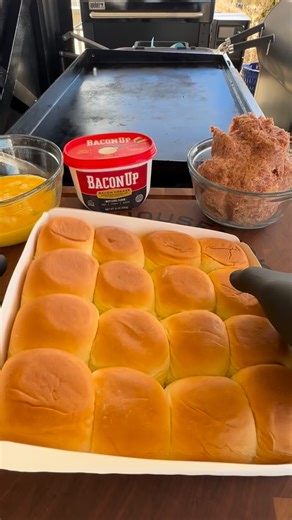 Nicholas Perrone on Instagram: "These breakfast sliders are just another easy and delicious way to feed a group! Set your griddle on medium and grease it up with @baconupbacongrease While it’s coming to temp, form your breakfast sausage (about 1.5-2lbs) into the shape of your @kingshawaiian roll tray. Add your sausage to the griddle followed by at least 7 pieces of bacon. The bacon will be done before that big ole sausage patty so push it off into the cool zone. Once ya flip the sausage and it a