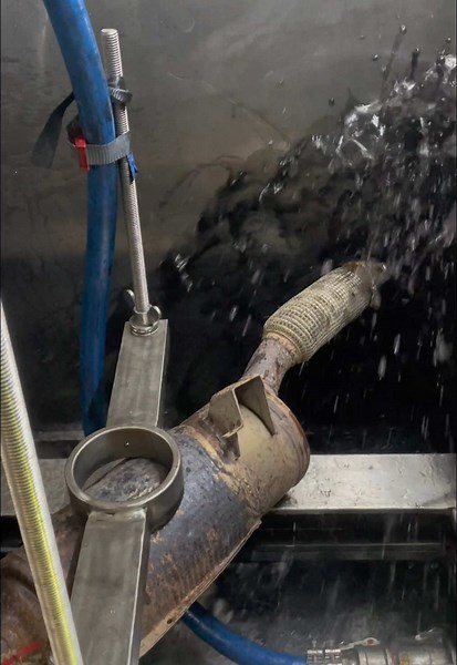 During a diesel particulate filter (DPF) cleaning a burst of soot and water can occur due to the rapid combustion and flushing of accumulated particulates and residue. Here’s why: 1.\tSoot Release – The DPF traps soot and ash from diesel exhaust. During cleaning (especially during forced regeneration or hydro-cleaning), high temperatures burn off the trapped soot which can then be expelled as a burst of fine carbon particles. \t2.\tWater Release – If a hydro-cleaning method is used water is inje