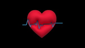 Download Red heart icon and animated pulse on black background. for free