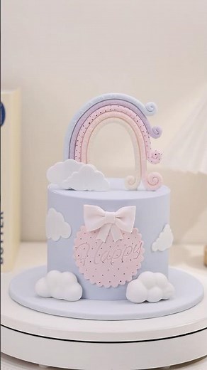 🌈☁️Pastel rainbow cake featuring an adorable fondant topper.