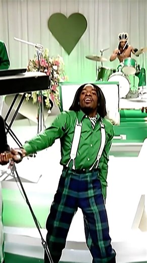 Andre 3000 of Outkast Outfit, 2003 | André 3000 wore this outfit in Outkast's music video for "Hey Ya!" The video was inspired by The Beatles' debut performance on The Ed Sullivan Show, but flipped the story to depict an American band, The Love Below, taking swinging London by storm. Andre 3000 played all eight band members and performed the song in its entirety 23 times to get the required takes. The video won four MTV Music Video Awards in 2004, including Video of the Year. Explore the new 202