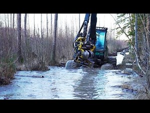 Timberjack 1270D harvester in winter forest