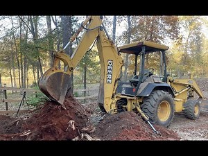 DIGGING BIG STUMPS WITH JOHN DEERE 310E BACKHOE
