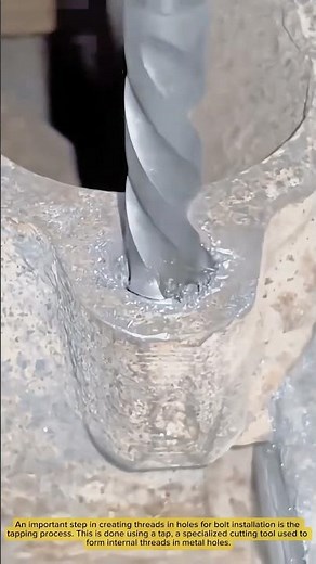 This is Forming Bolt Hole Threads by a Worker in a Metal Workshop with a Tap Tool
