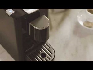 Capino Machine - Making coffee and ejecting capsules