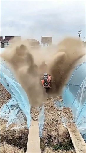 Using a Self-Propelled Tracked Trencher to Build Drainage Between Greenhouse Tunnels !