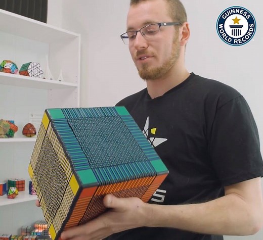 6.9M views · 11K reactions | Puzzle designer Grégoire Pfennig from France created an incredible 3D printed 33x33x33 Rubik's Cube - with 6153 moveable parts! | Guinness World Records | Facebook