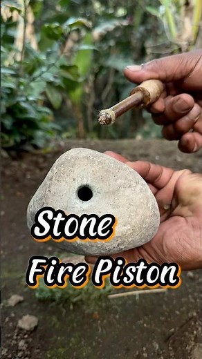 Making fire using stone fire piston #firepiston #primitivefirelighting #survivalfire #firemaking