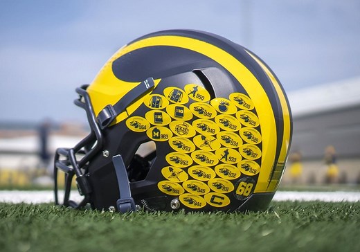 What are the stickers on college football helmets?