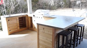 How to Build a Sleek Outdoor Kitchen With BBQ and Bar at Minimal Cost