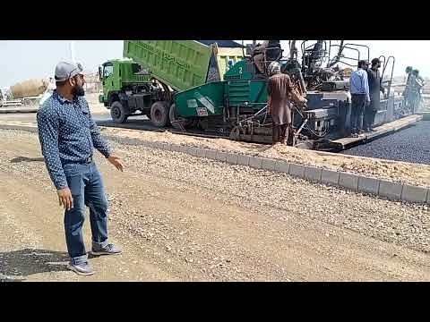 Asphalt base course laying. ||Asphalt pavement.
