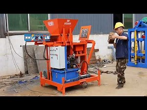 Electric motor version compressed earth interlocking block making machine test half ISSB eco blocks