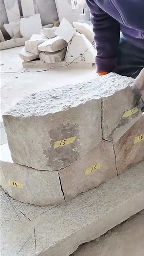 Precision Stone Masonry: Cutting and Fitting Interlocking Wall Blocks