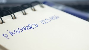 writing password on a sticky note